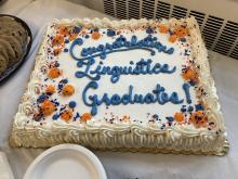 Photograph of cake decorated to read "Congratulations Linguistics Graduates!"